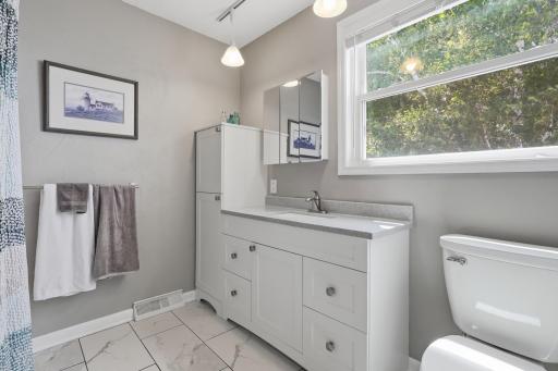 Upstairs Primary Suite Bath and yes big window that overlooks the lake!