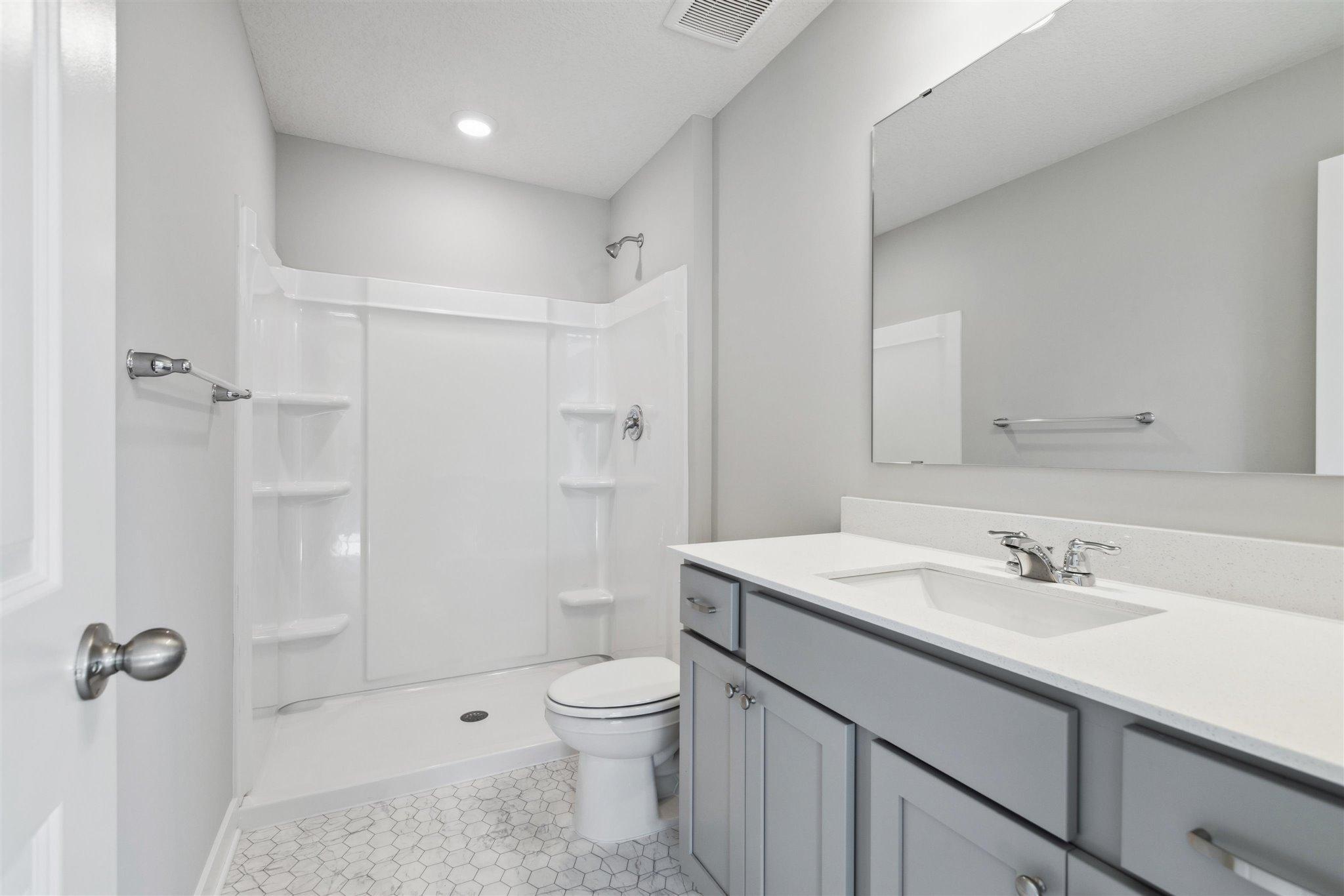 Primary, private ensuite bathroom provides an escape from the rest of the house. *Picture is of model home; actual finishes may vary.