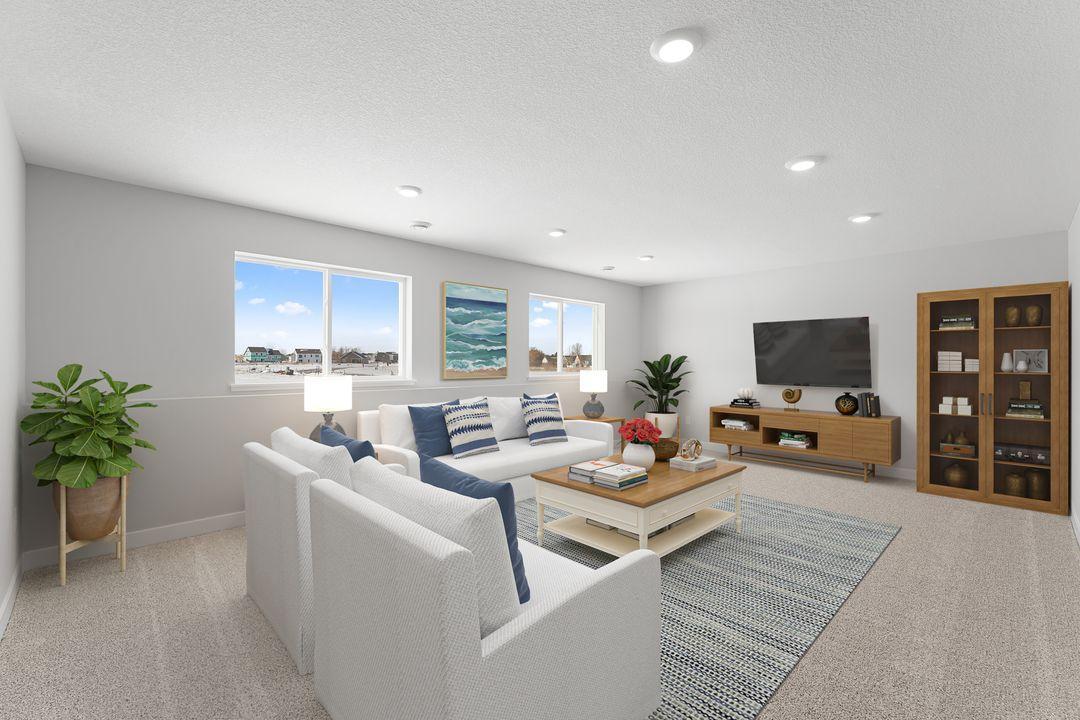 Included finished lower level with family room, bedroom and full bath. Photo of a virtually staged Model Home. Options and colors may vary. Ask Sales Agent for details.