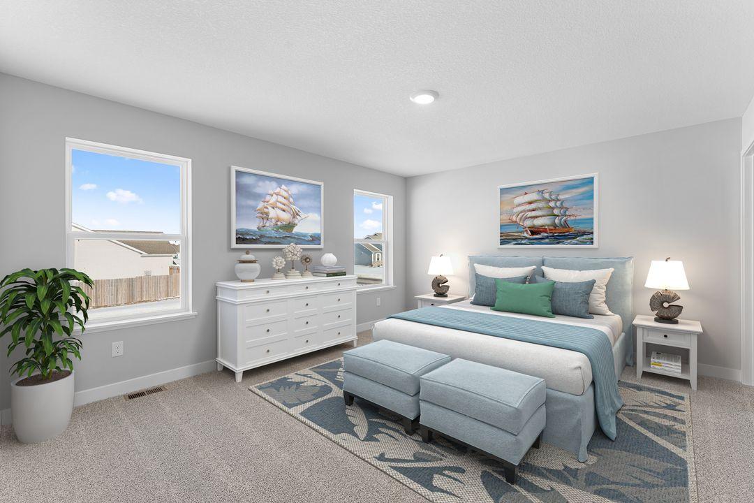 An oasis of its own, the primary suite offers the perfect escape. There's immediate access to a private bathroom featuring dual sinks & a large shower. Photo of a virtually staged model home. Colors and options may vary. Ask Sales Agent for details.