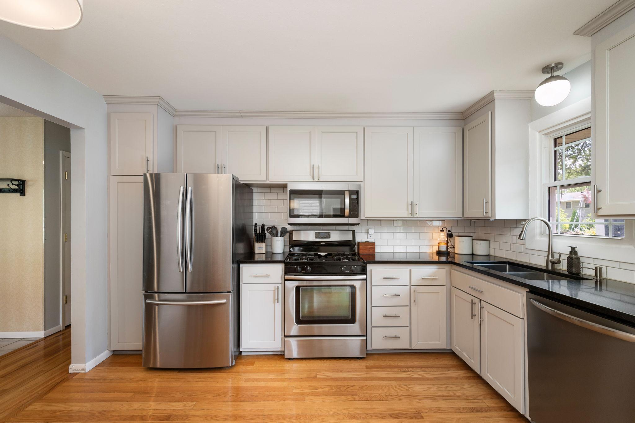 Light and bright kitchen with stainless steel appliances