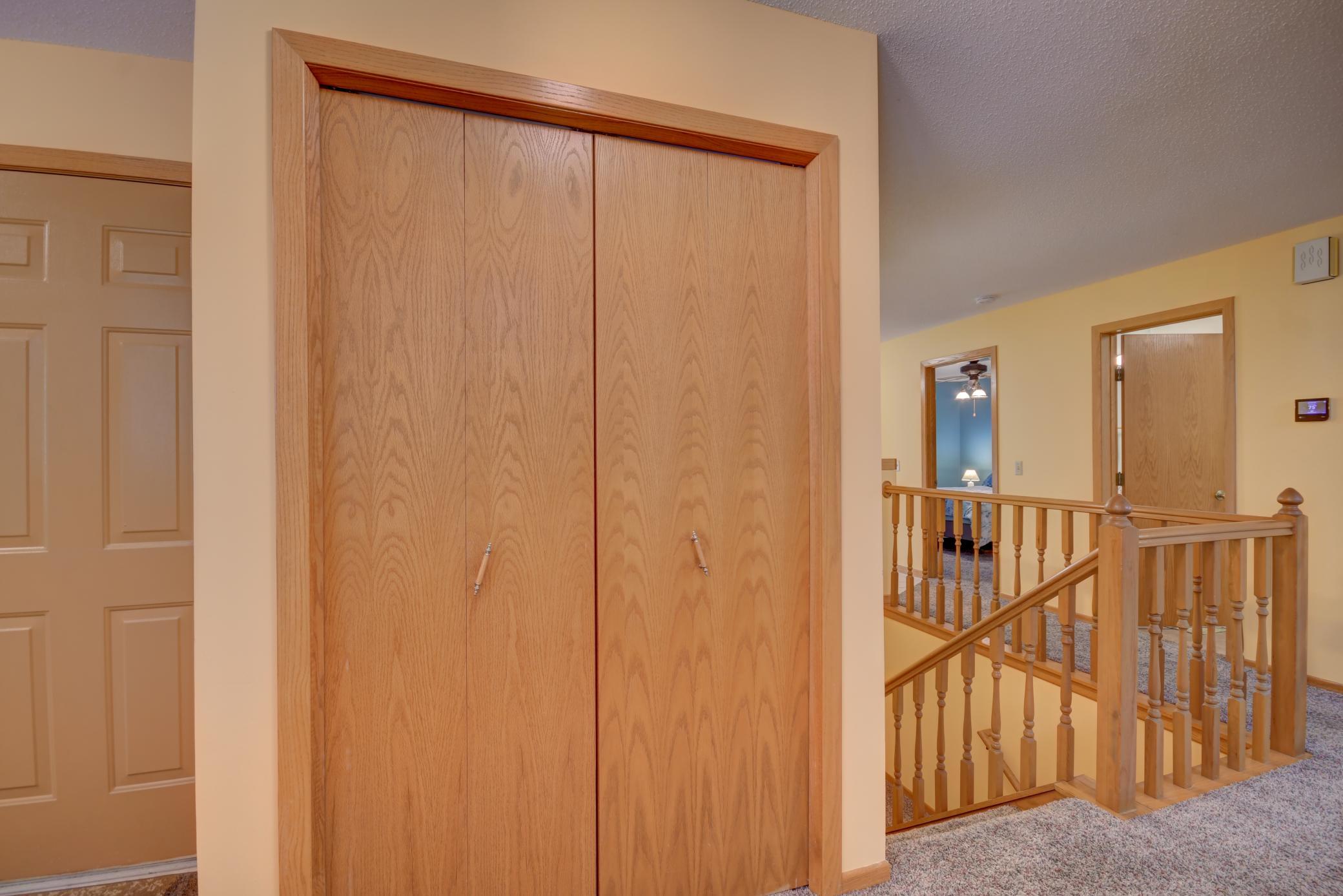Hall Closet and Stairs to Lower Level