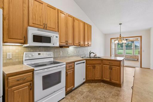 spotless kitchen with ample cabinet and pantry area