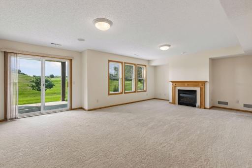 wide open lower level family room with a golf course view