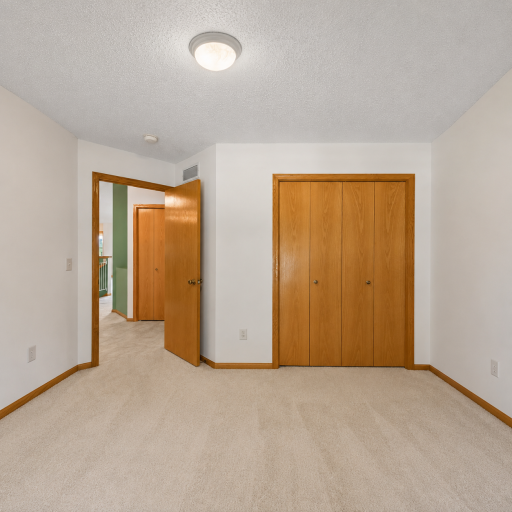 main level second bedroom ~ virtually enhanced to remove furniture