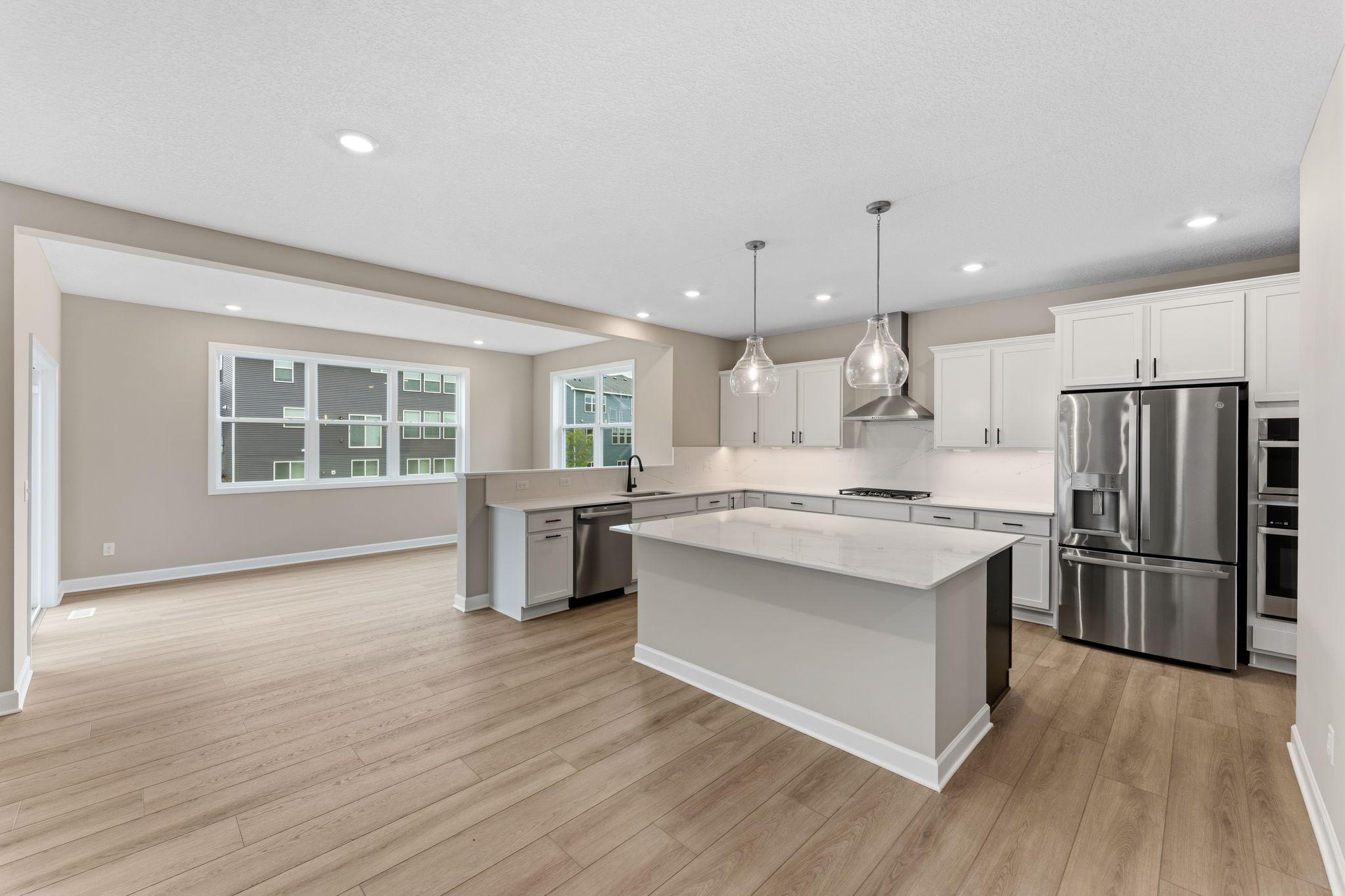 The spacious kitchen naturally serves as the heart of this home, complete with a generous center island, brand-new appliances and a walk-in pantry. The morning room provides a sunlit space for meals of any kind, just off the kitchen.