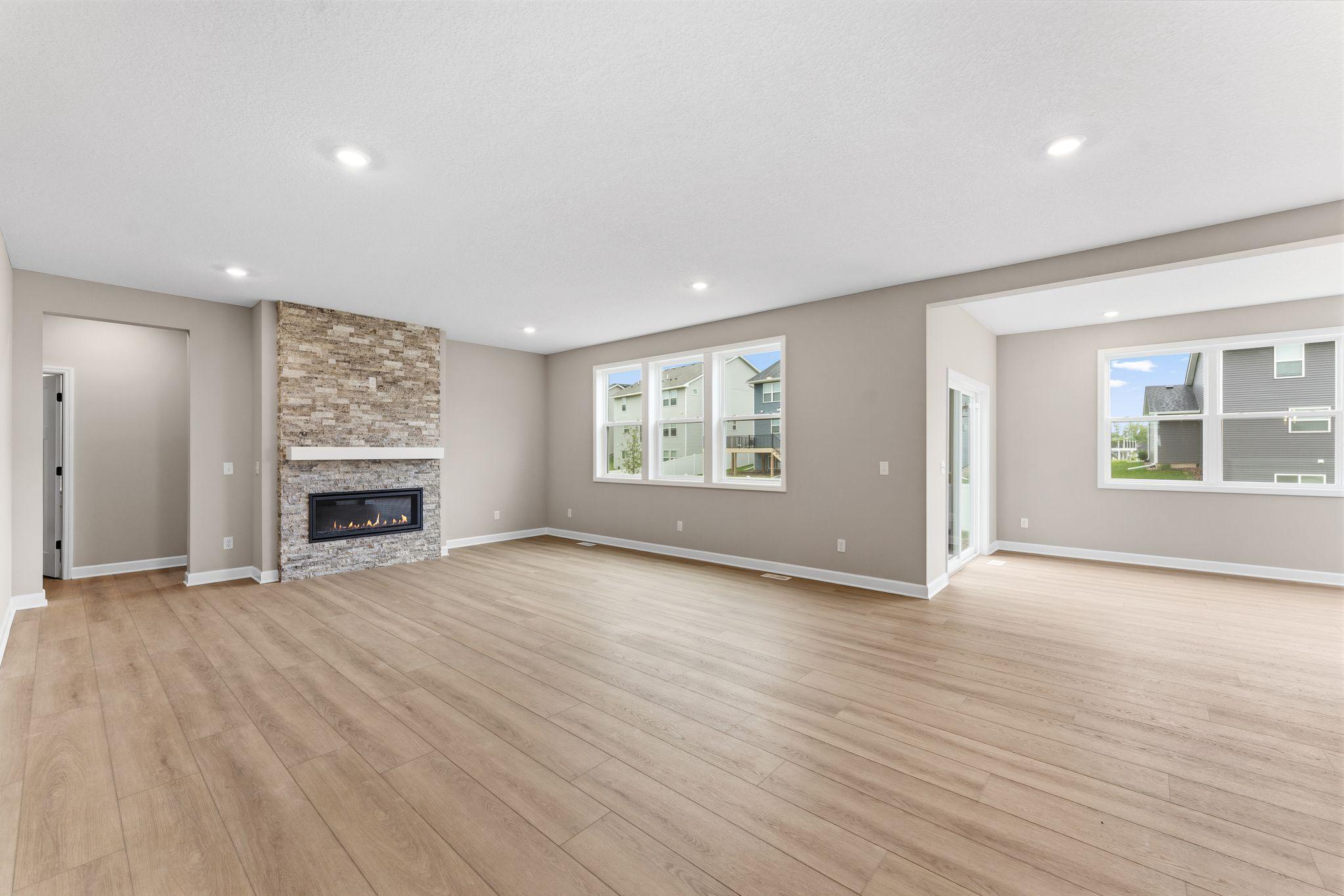 Enjoy shared moments with loved ones in the comfortable and spacious Great Room, where expansive windows flood the space with natural light. Sliding glass doors lead to the outdoor space