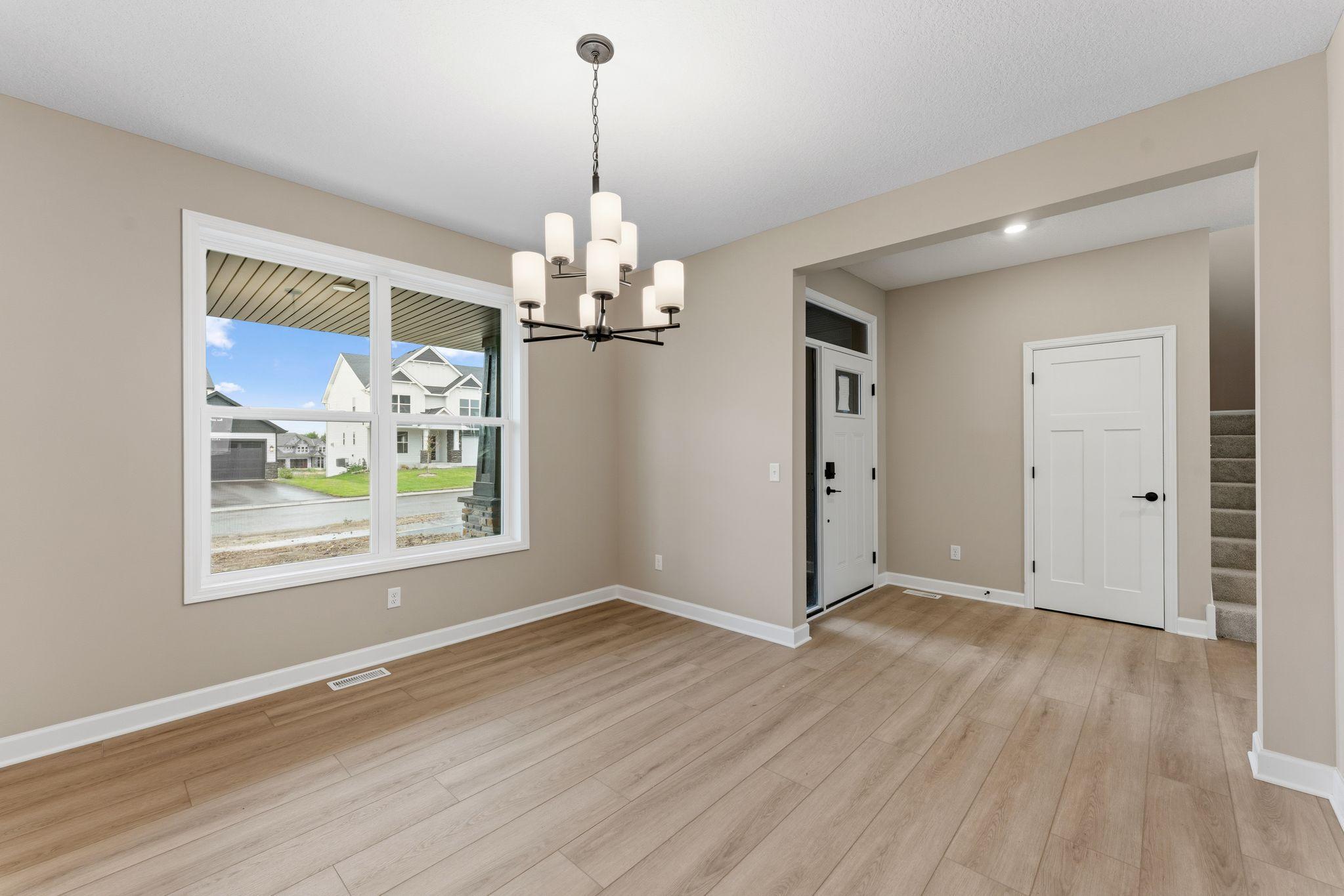 A formal dining room is easily accessed through the kitchen, ideal for dinners with extended family and holiday celebrations with guests.