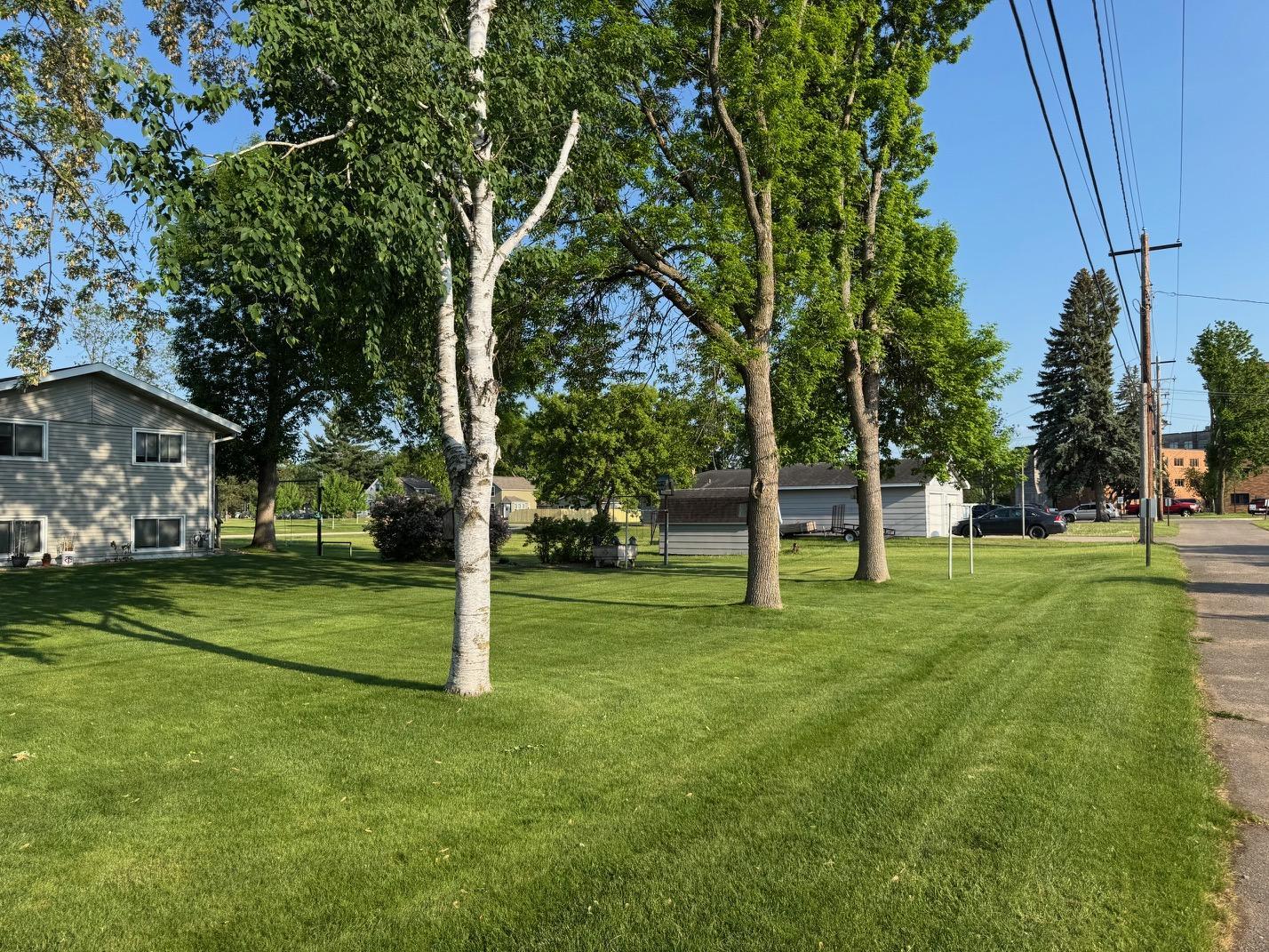 Mix of mature trees & lush lawn