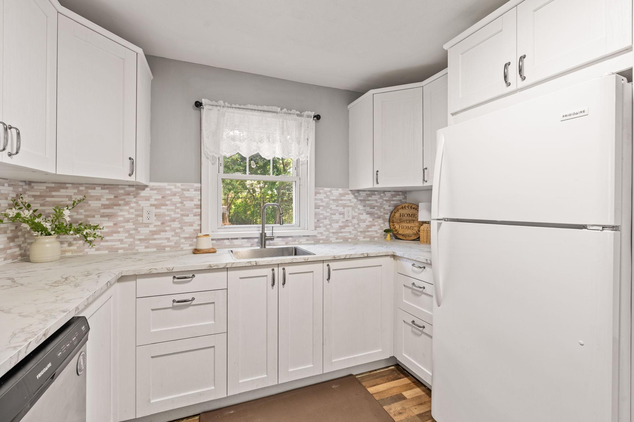 Functional kitchen offering generous cabinetry and workspace.