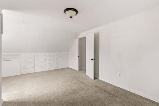 Upper room with built-in drawers provide convenient storage without sacrificing floor space.