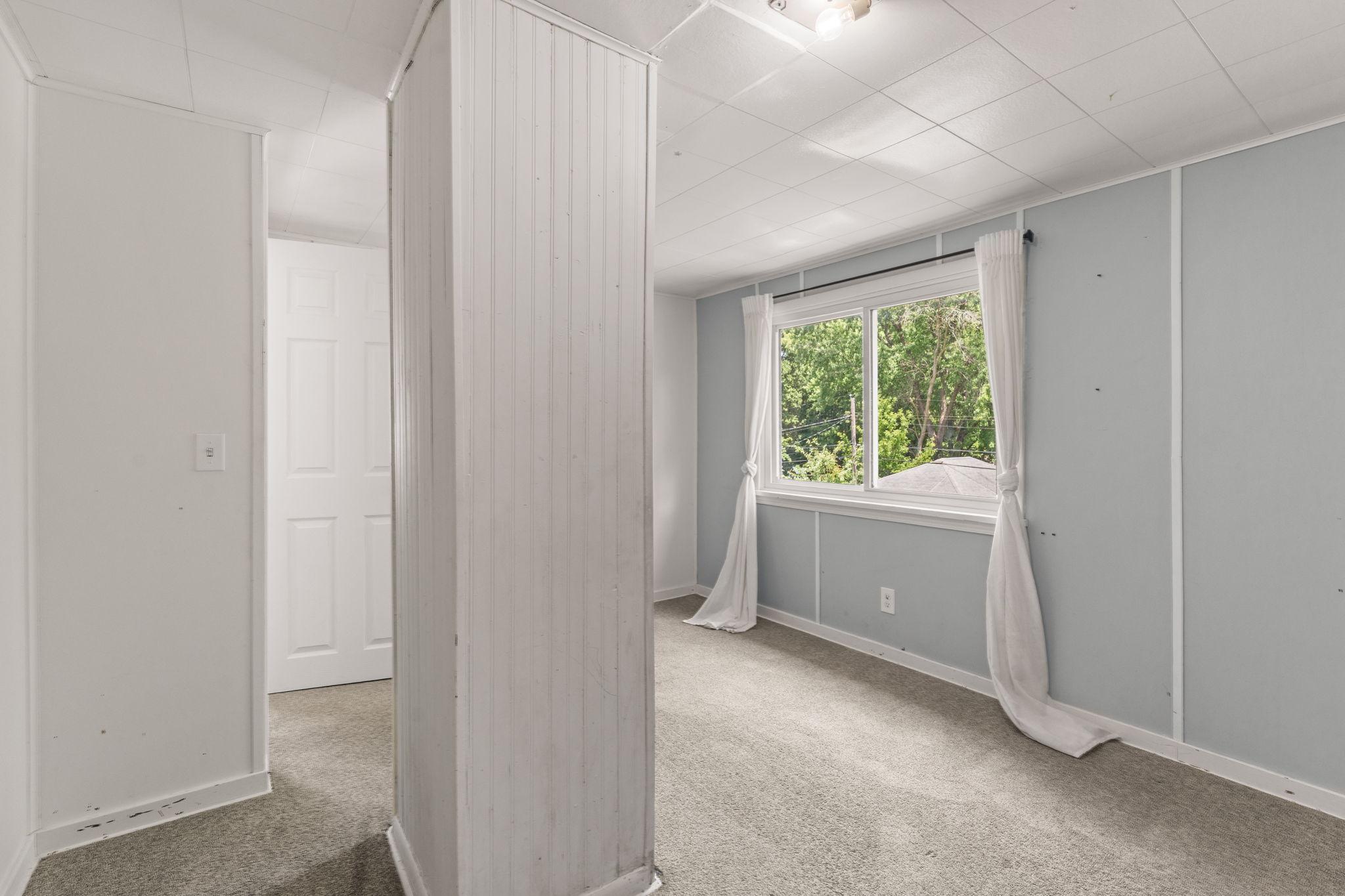 Versatile upper-level bedroom, office, or creative space.