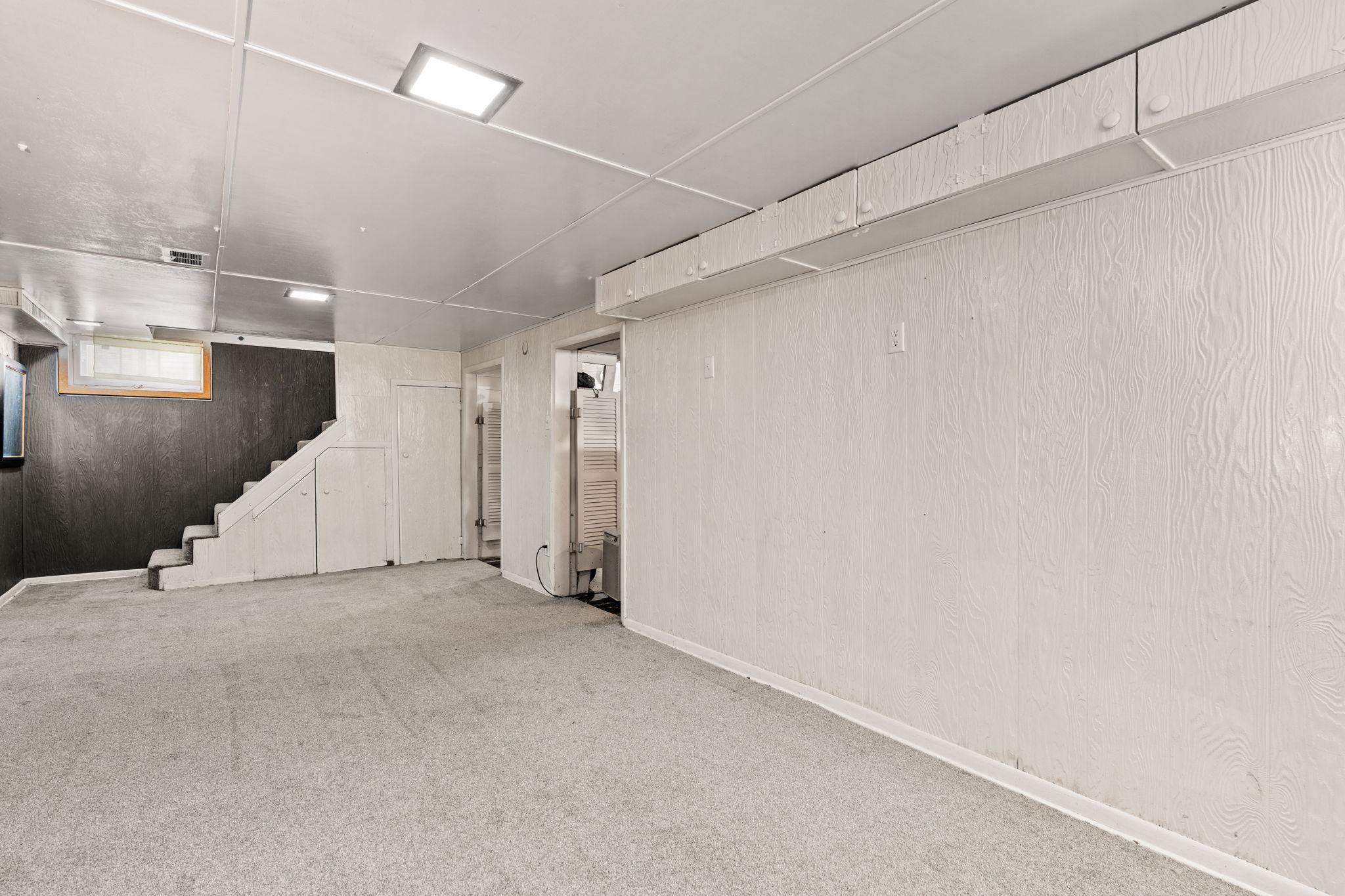 Spacious lower level with room for hobbies, storage, and access to the home’s updated mechanical systems.