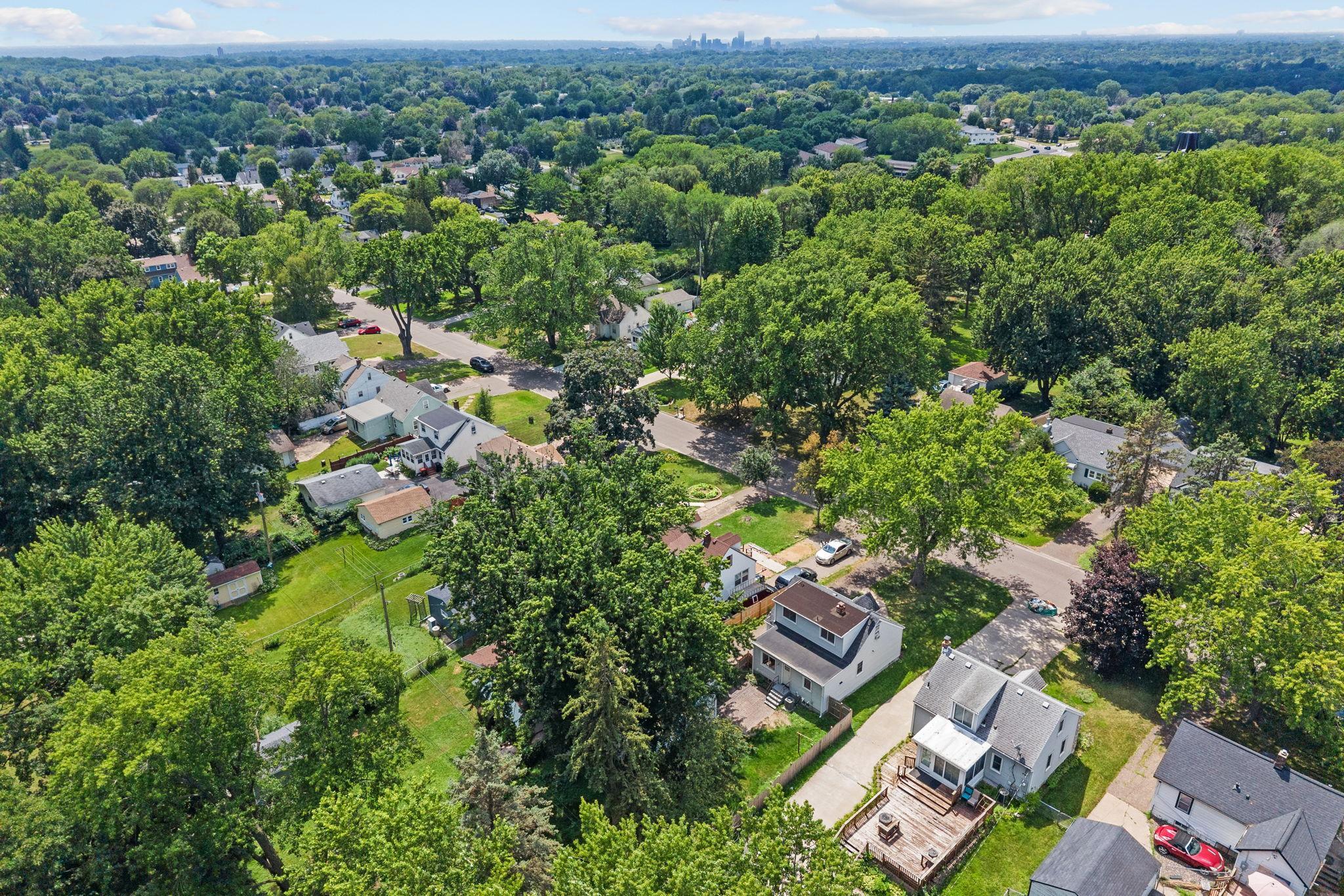 Aerial view showcasing the home’s established Maplewood neighborhood.