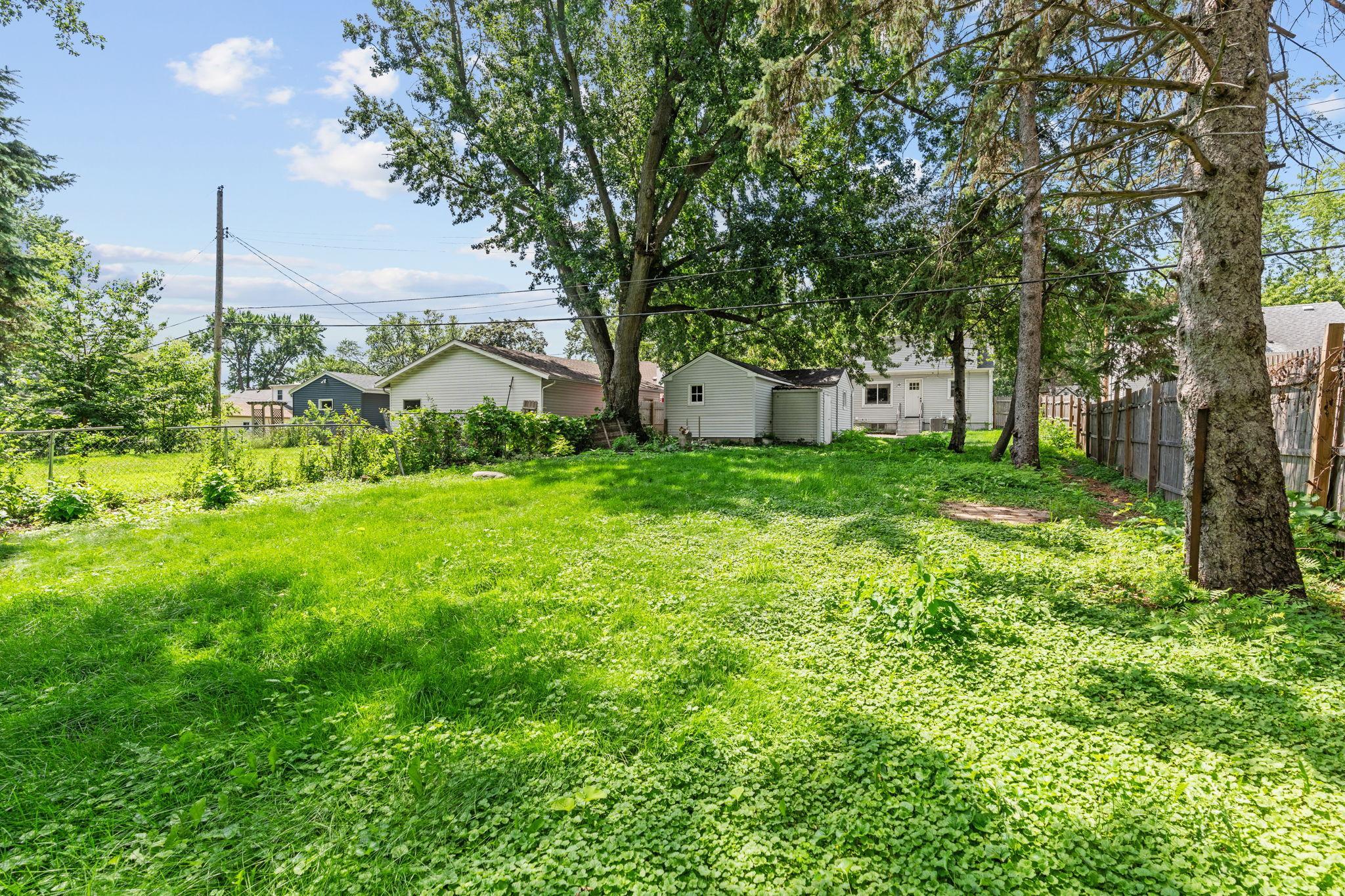Stretching approximately 294 feet deep, this rare backyard offers incredible space and privacy.