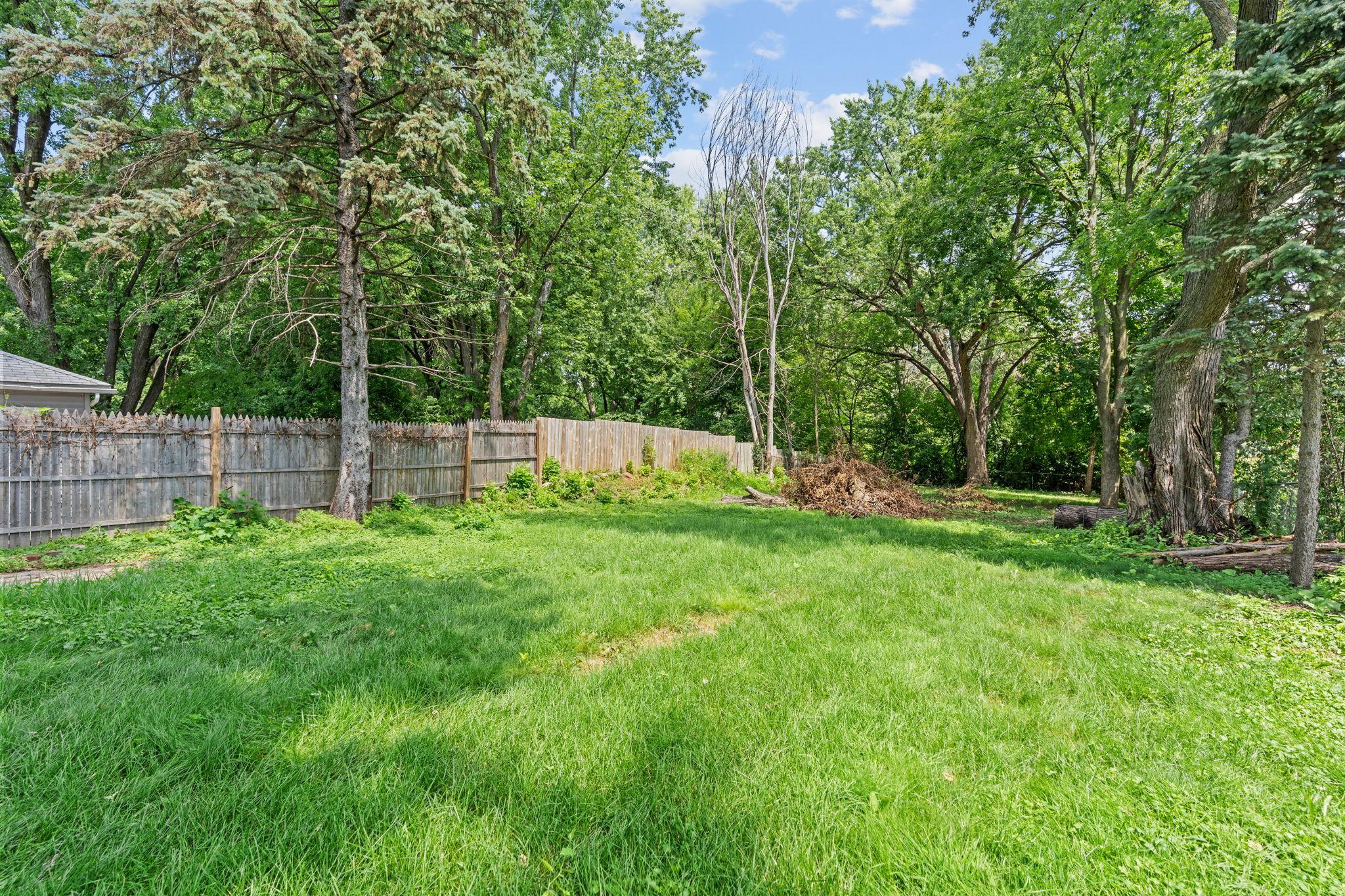 A truly impressive backyard with endless potential for gardens, outdoor gatherings, recreation, and relaxation.