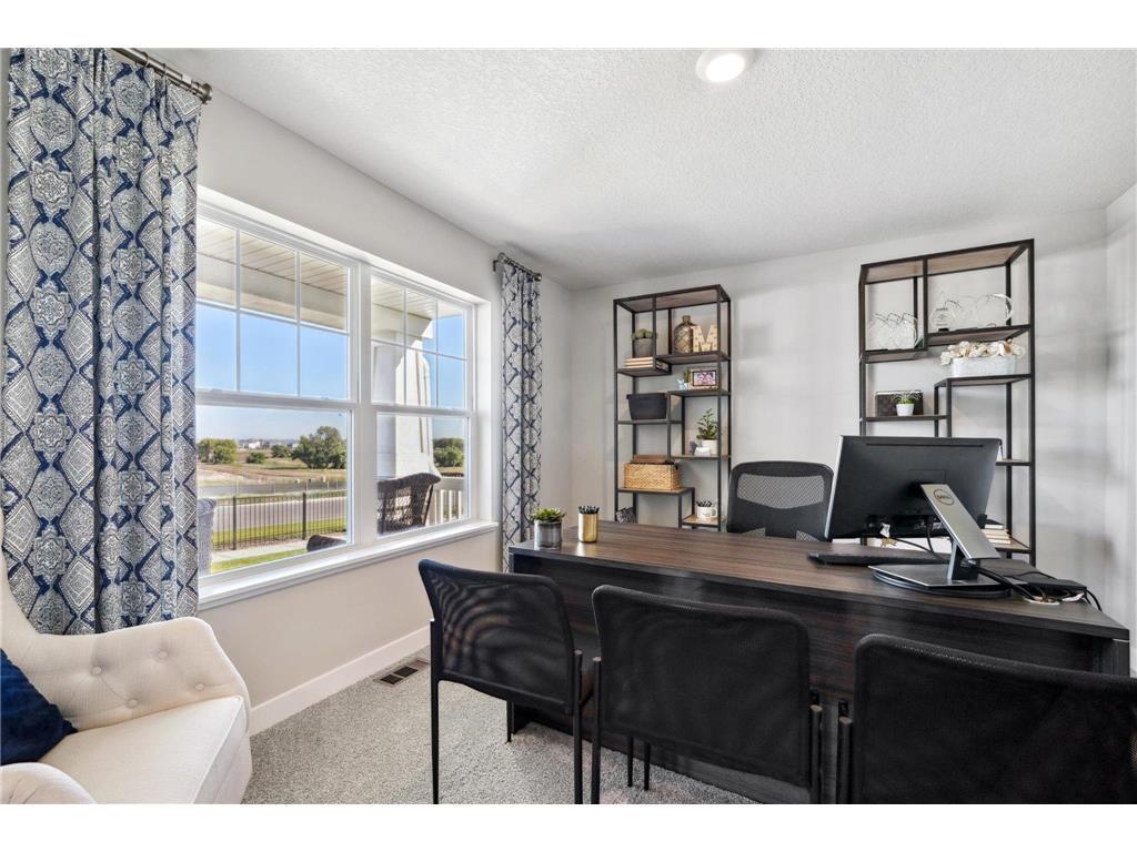 Office on the main level with a view to the front yard