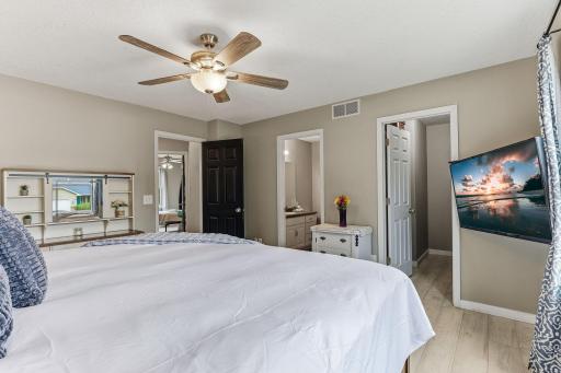 Primary bedroom with walk in closet and 3/4 bath.