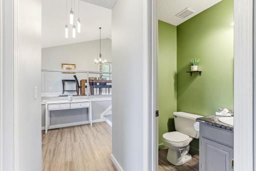 Guest half bath off entry and across from the laundry room.