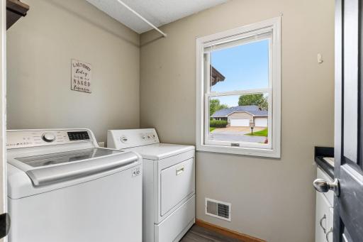 Main floor laundry room steps from garage and half bath.