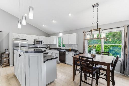 Informal dining overlooks backyard.