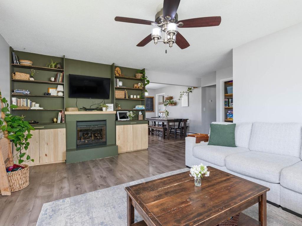 Take note of the big beautiful built in for additional storage and adding a warm, cozy feel to the room.