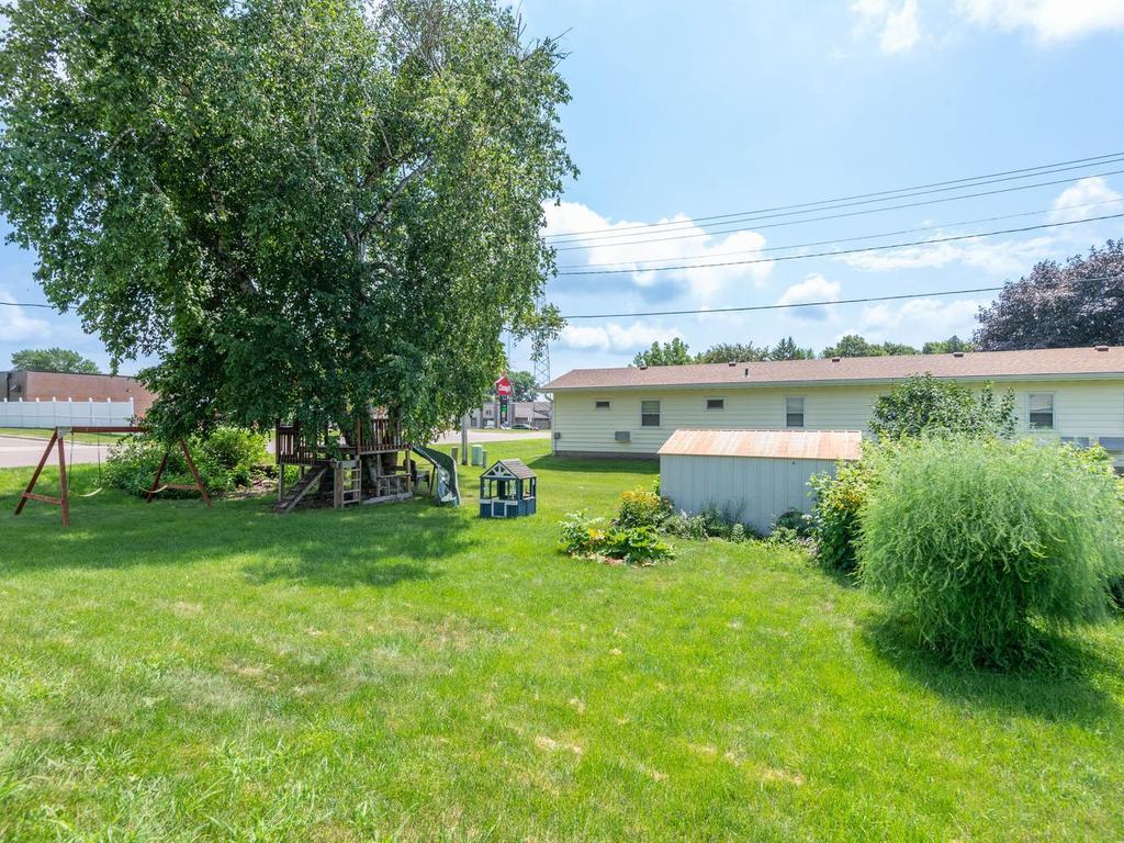 The yard offers a built-in playhouse, rhubarb and a storage shed!
