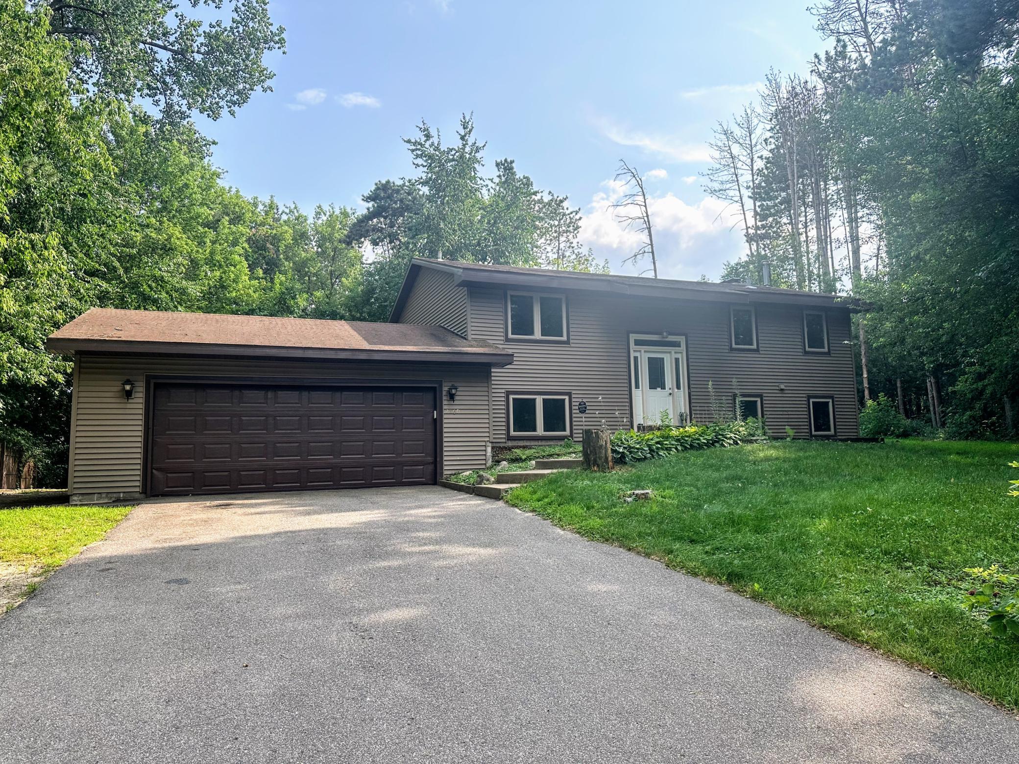 Unique 3BR/2BA Ham Lake home nestled on a wooded lot