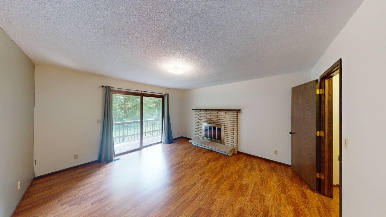 Primary suite w/fireplace, balcony/deck, walk-in closet and access to walkthrough bathroom