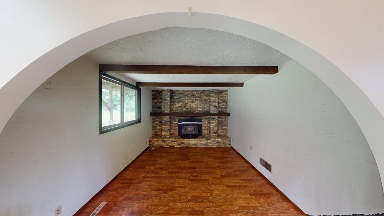 Den w/cozy fireplace w/brick surround