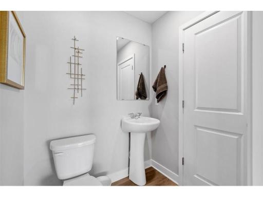 Convenient half bath is situated on the main level.