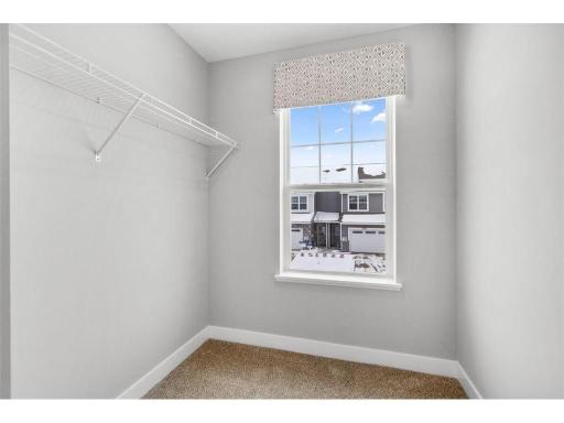 Bedroom #2 gets it's own large walk-in closet with a window!