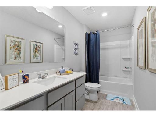 The spacious bathroom offers a great solution for a busy family.