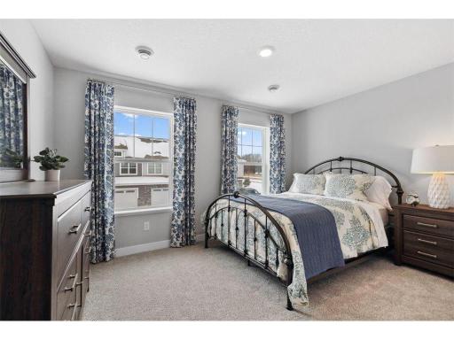 Tucked away from the hustle and bustle of the main level living spaces, this bedroom resides adjacent to a full bath and serves as the perfect guest room or your home office!