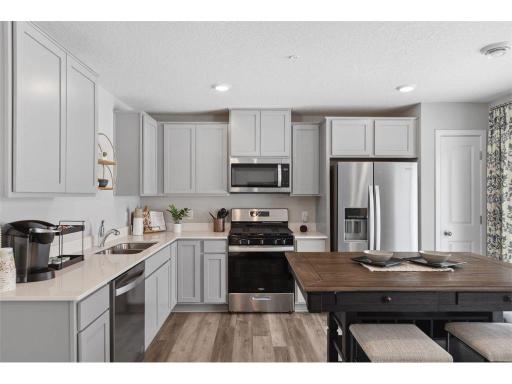 Stainless appliances, quartz counters, gas range....what's not to love?