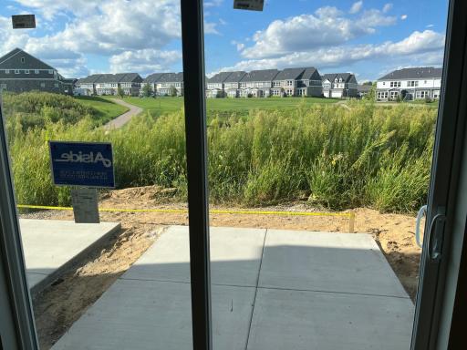 Backyard view (grass will get cut and there will be a privacy divider added)