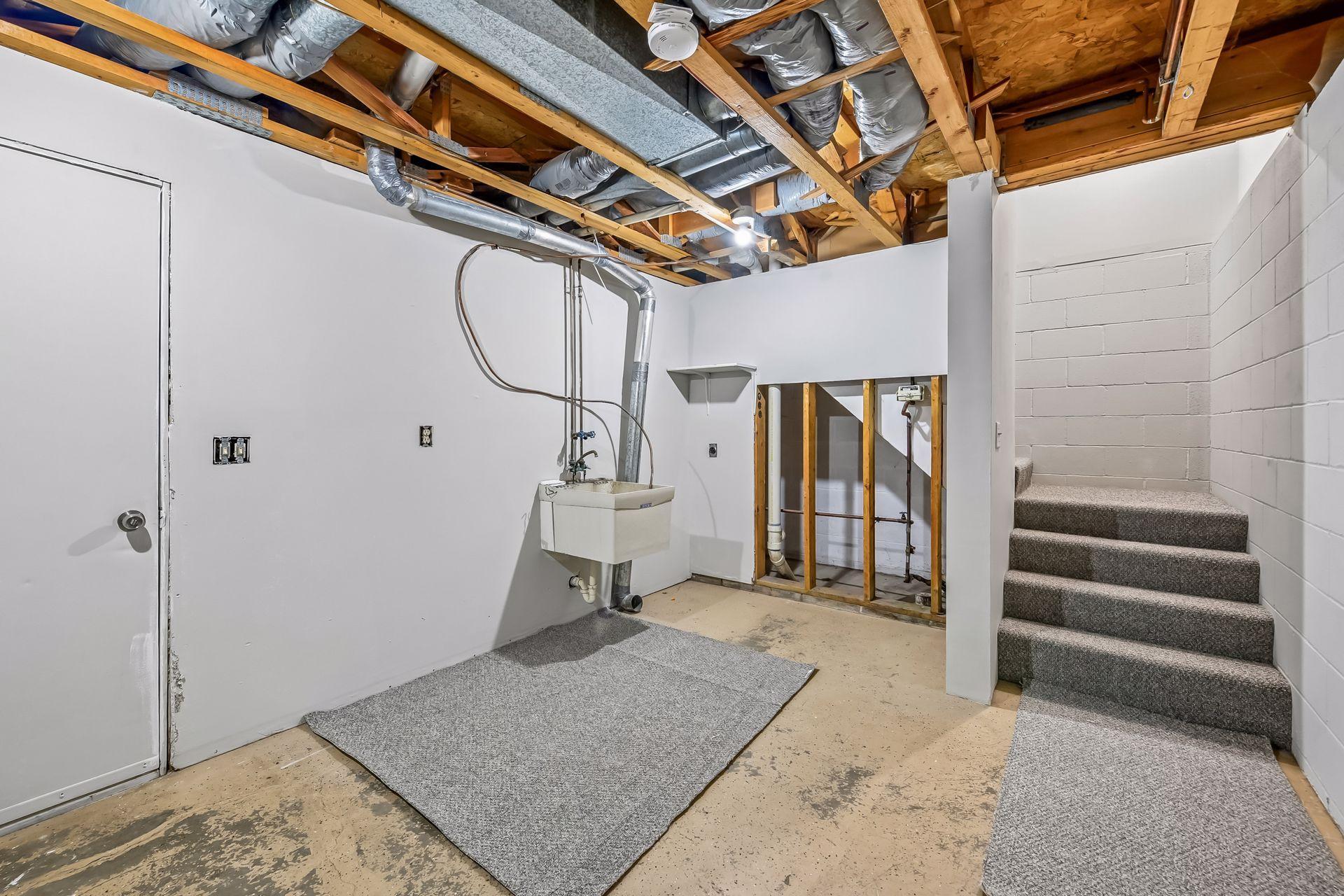 Utility Sink and Stair Case to Main Level