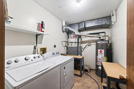 Laundry room with plenty of storage. Newer W & D