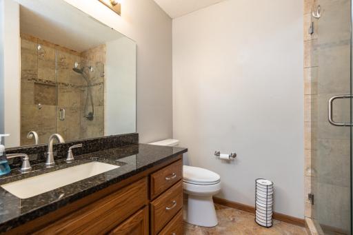 Private primary bathroom features a gorgeous tile shower