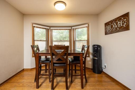 The informal dining room even has a view of the pool