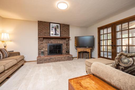 The main floor family room has a cozy wood burning fireplace