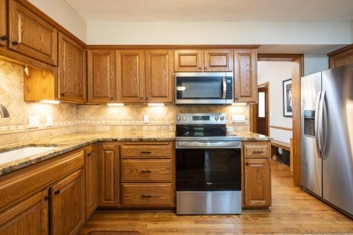 Granite countertops and tile backsplash