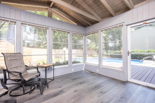 The expansive three season porch overlooks your own private outdoor oasis