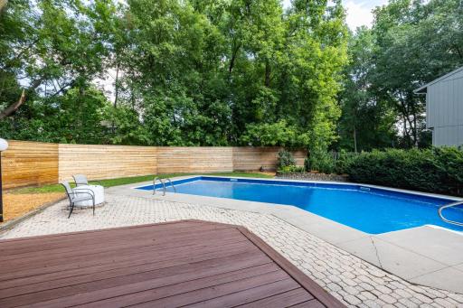 The inviting deck just off the three season porch has amazing views of the backyard
