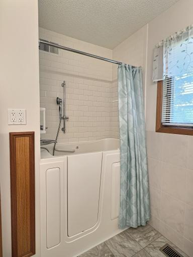 Step in tub and shower combination.