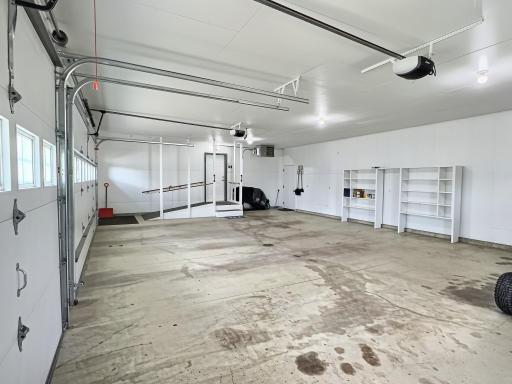 3 car insulated and heated garage with ramp.