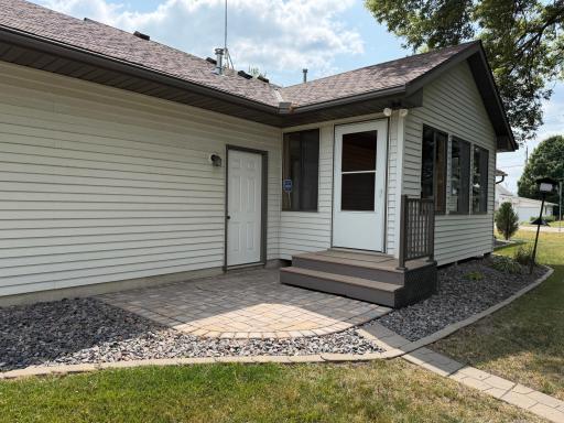 Back patio with pavers, step out from the 3 season porch.