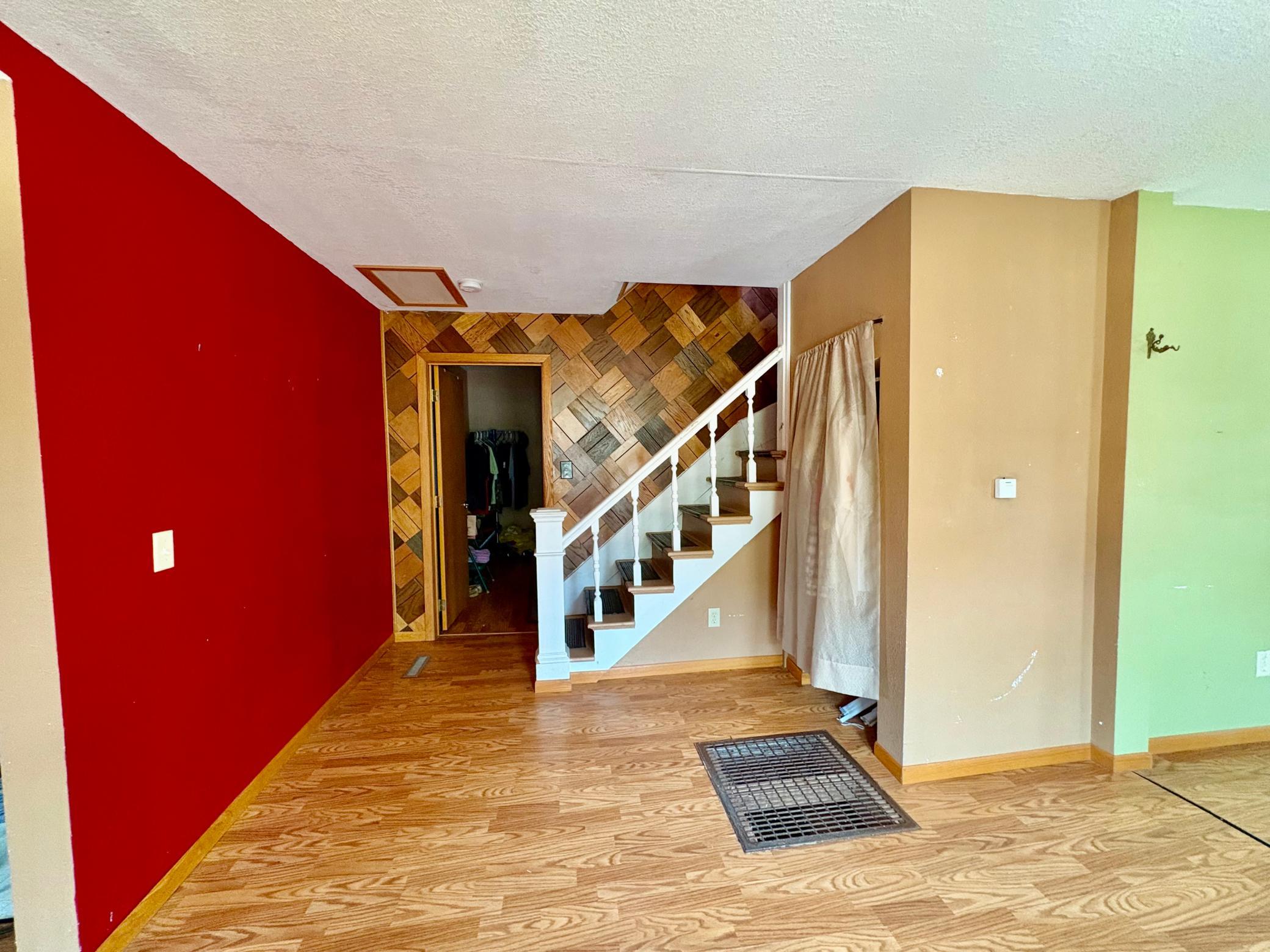 Stairway to upper level- door to main level bedroom