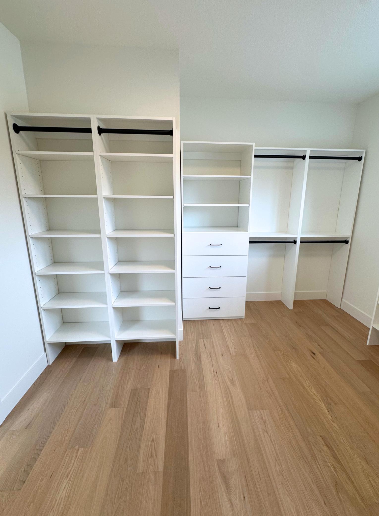 Primary Walk-In Closet w/ Stacked Washer/Dryer