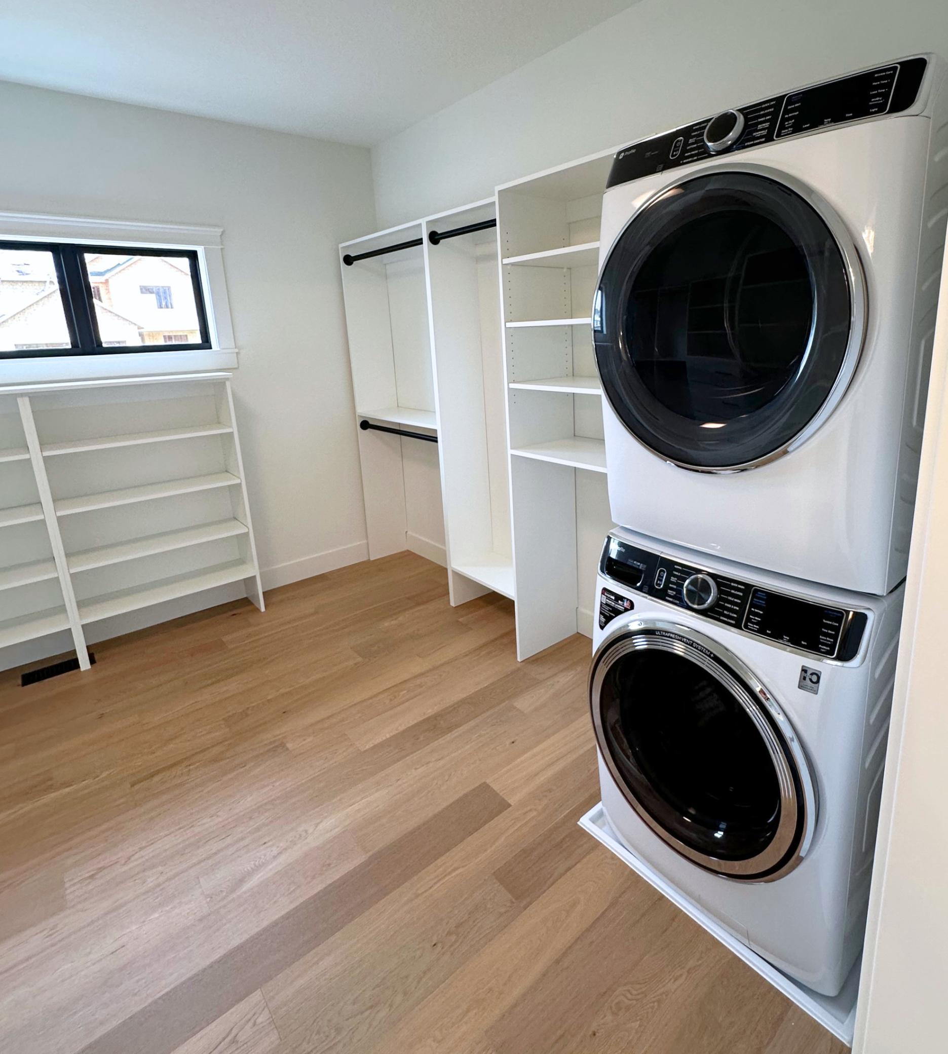 Primary Walk-In Closet w/ Stacked Washer/Dryer
